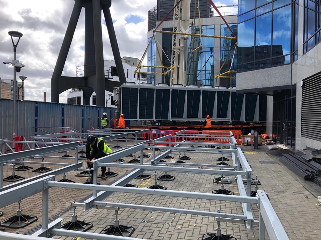 JJS operatives installing mechanical plant on a London site