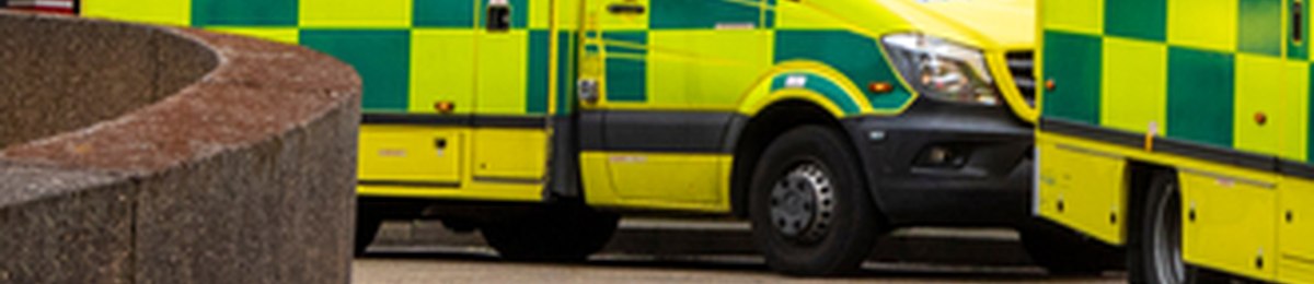 Ambulance parked outside a healthcare building